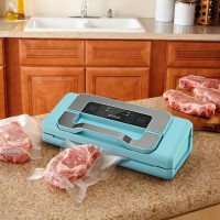 Вакуумный упаковщик Kitfort КТ-1535 110Вт 0.8Бар шир.пак.:30см голубой/серебристый